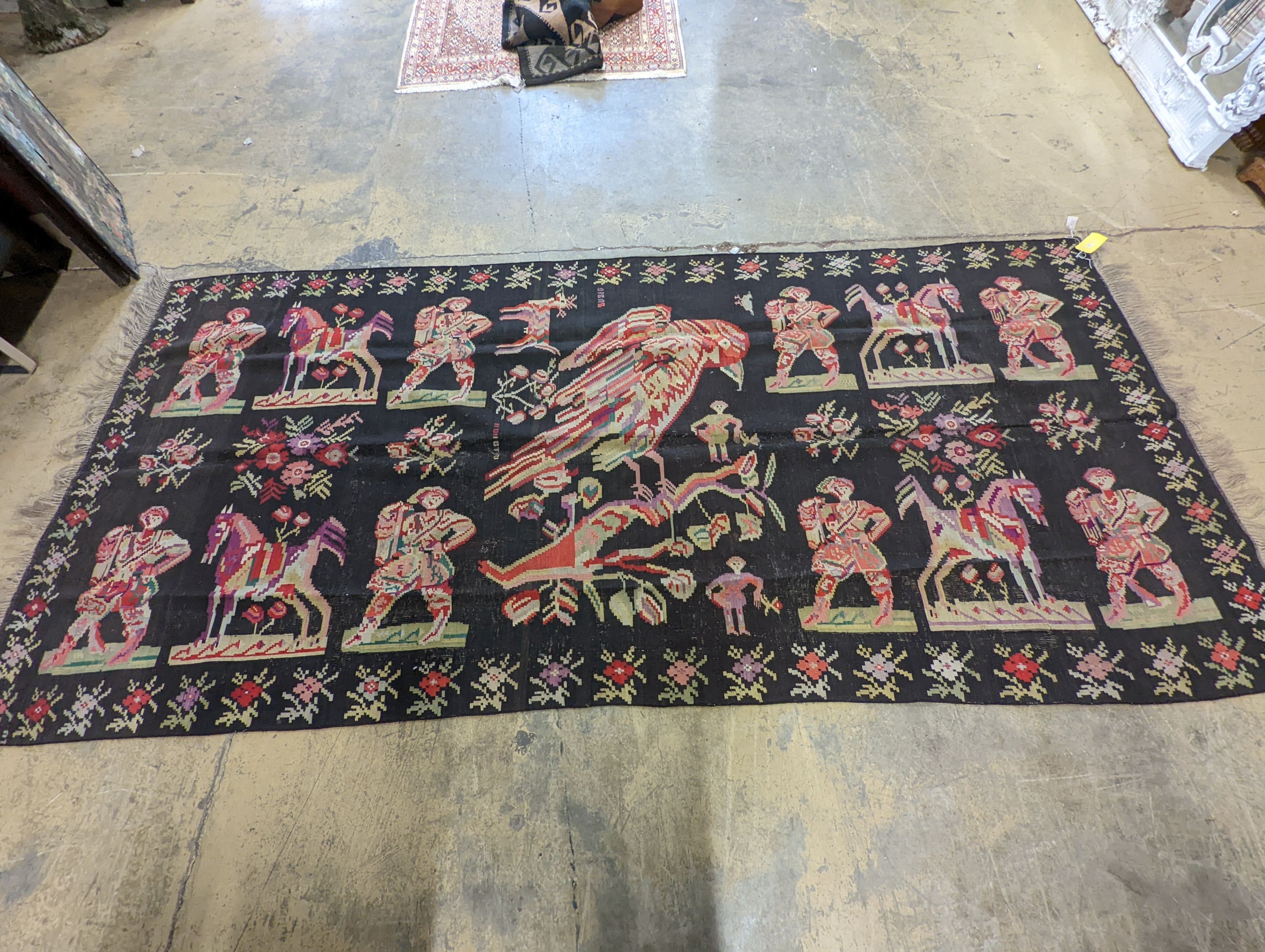 An antique Besbarabiam Kelim flatweave carpet woven with figures and birds, approx. 350 x 170cm